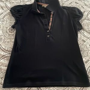 Like new authentic Burberry woman’s Polo.  Navy Blue size L